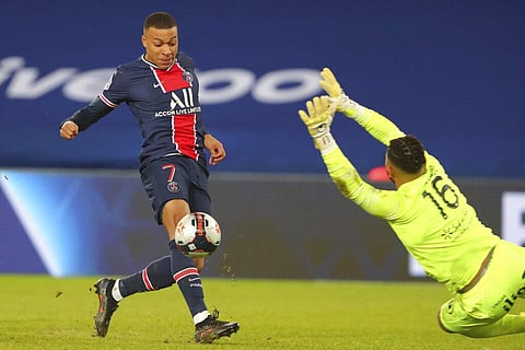 PSG's Kylian Mbappe scores his side's opening goal during the French League One soccer (Photo | AP)