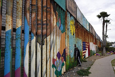 A man looks through the first wall at Friendship Park, near where the border separating Tijuana, Mexico, and San Diego meets the Pacific Ocean Tuesday, Jan. 19, 2021, in Tijuana, Mexico. (Photo | AP)
