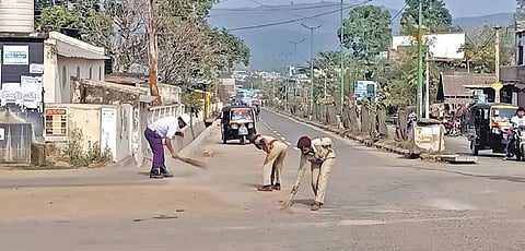 Cops cleaning sand at Phulbani in Kandhamal district on Friday. (Photo | Express)
