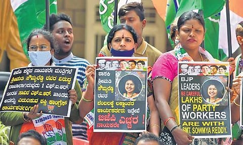 Congress workers come together in support of MLA Sowmya Reddy and slam the state government during a protest in Bengaluru on Saturday | Meghana Sastry