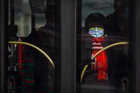 A woman wearing a face mask to cover her nose and mouth to protect against the spread of the coronavirus. (Photo | AP)
