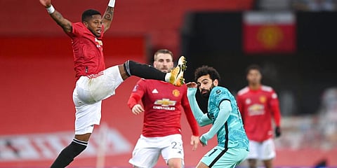 Manchester United's Fred (L) challenges Liverpool's Mohamed Salah during the English FA Cup match. (Photo | AP)
