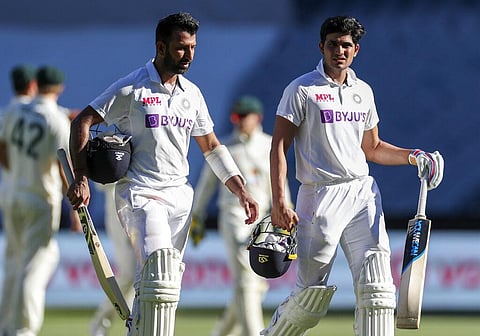 India's Cheteshwar Pujara, left, and teammate Shubman Gill walk from the field at the end of play play on day one. (Photo | AP)