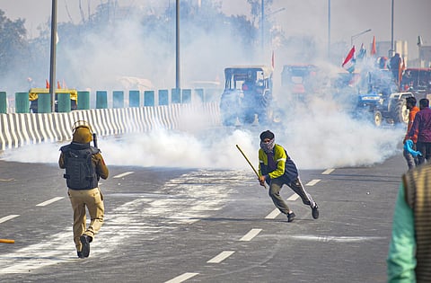 Police uses tear gas to disperse farmers attempting to break barricades as they try to march towards ISBT during the 'Kisan Gantantra Parade' amid the 72nd Republic Day celebrations, in New Delhi. (Ph