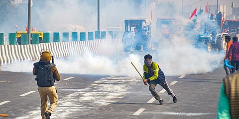 Police fires teargas shells as farmers attempt to march towards Delhi during the 'Kisan Gantantra Parade' amid the 72nd Republic Day celebrations at Akshardham. (Photo | PTI)