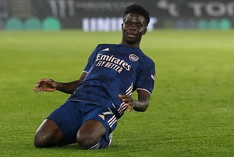 Arsenal's English striker Bukayo Saka celebrates scoring his team's second goal. (Photo | AFP)