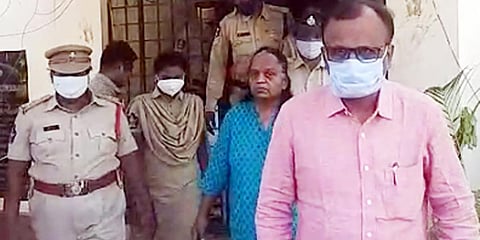 Chittoor police taking couple, who are accused of murdering their two daughters, into custody in Madanapalle on Tuesday. (Photo| EPS)