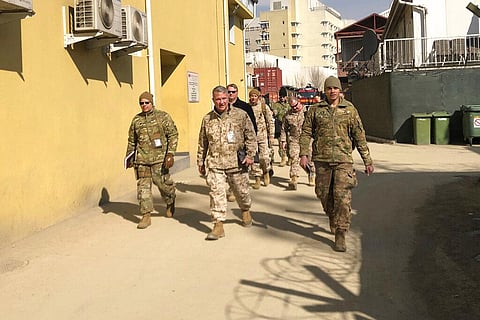 Marine Gen. Frank McKenzie, center, top U.S. commander for the Middle East, makes an unannounced visit in Kabul, Afghanistan. (File photo | AP)
