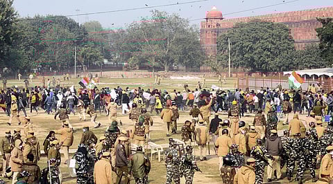 Police chase away protesters and farmers who had reached the Red Fort after the Republic Day parade in Delhi. (Photo | Parveen Negi, EPS)