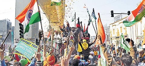 Farmers take out tractor rally near Nangloi on Tuesday. (Photo | Parveen Negi, EPS)