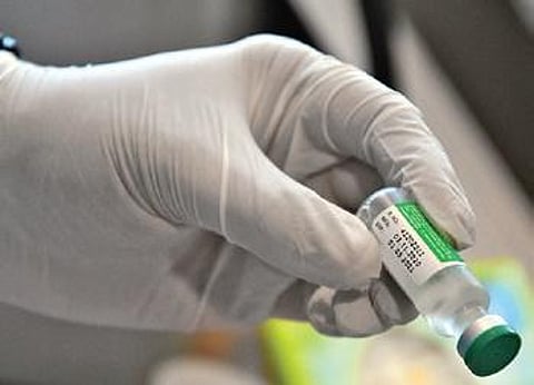 A health worker with a vial of the Covishield vaccine | Ashishkrishna HP