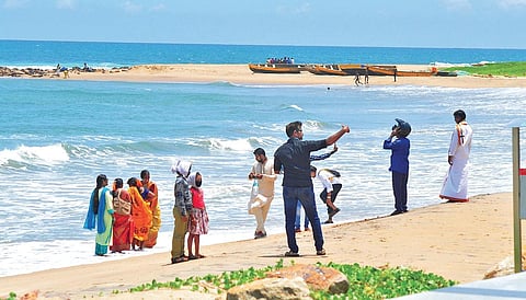 Tourists throng Rushikonda beach in Visakhapatnam with the resumption of operations of tourism sector after lockdown. (File photo I EPS/G Satyanarayana)