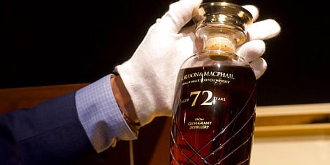 72-year-old bottle of Glen Grant single malt whisky from Scotland is displayed at a Bonhams auction preview in Hong Kong. (Photo | AP)