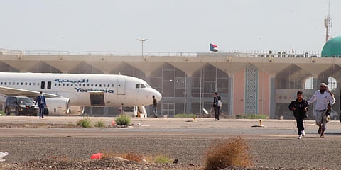 People walk away from the runway following an explosion at the airport in Aden. (File photo| AP)