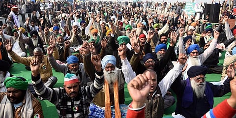 Farmers shout slogans during their protest against the new farm laws at the Delhi-UP border. (Photo | Parveen Negi)