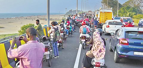 People taking photos of the beach from Alappuzha bypass flyover causing traffic snarls on the bridge | Express