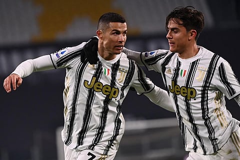 Juventus' forward Cristiano Ronaldo celebrates with forward Paulo Dybala (R) after scoring against Udinese on Jan 3, 2021 at the Juventus stadium in Turin. (Photo | AFP)