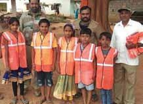 Children wear reflective jackets in Tumakuru | Express