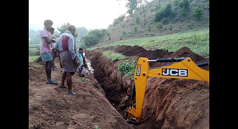Tribal farmers of Sarika, Varaka and Chintalavalasa restore a defunct irrigation canal on their own. (Photo | Express)