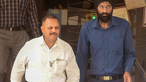 Lieutenant Colonel Prasad Shrikant Purohit (L)