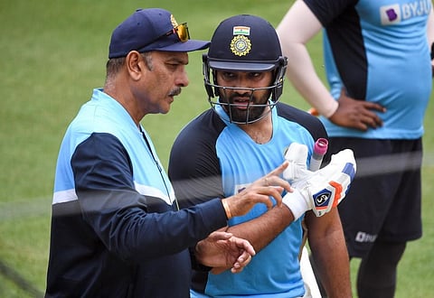 India's Rohit Sharma (R) chats with team coach Ravi Shastri (L) during a training session. (Photo | AFP)