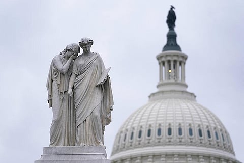 The Peace Monument, also known as the Naval Monument or Civil War Sailors Monument, is framed by the Capitol dome on Capitol Hill in Washington. (Photo | AP)