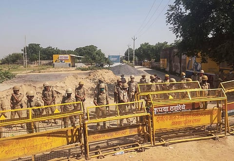 Police personnel seen standing guard near Bulgaddhi village following outrage over death of the 19-year-old Dalit woman who was allegedly gang-raped. (File Photo | PTI)