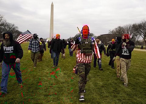Supporters of President Donald Trump are confronted by Capitol Police officers outside the Senate Chamber at the Capitol, Wednesday, Jan. 6, 2021 in Washington.| AP