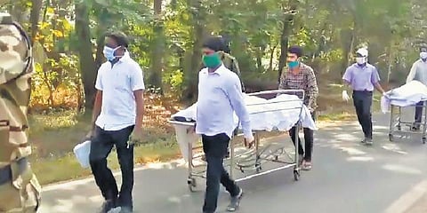 Body of a victim being carried to IGH I Express