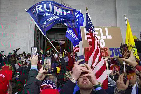 Trump supporters gather outside the Capitol, Wednesday, Jan. 6, 2021, in Washington. (Photo | AP)
