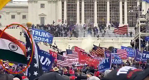 The video that has drawn flak from across sections shows a person holding the India flag amid Trump supporters. (Videograb)