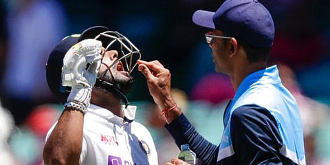 India's Rishabh Pant is given a pain killing tablet during play on day three of the Sydney Test. (Photo | AP)