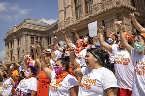 Women protest against Texas' restrictive abortion law at the Capitol in Austin, Texas.