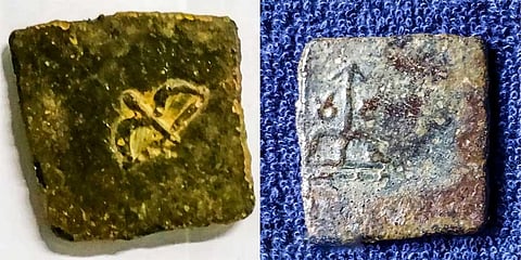 The Sangam-era Chera coins, inscribed with their identity of the bow and arrow, which were discovered across Karur district over the years | Express