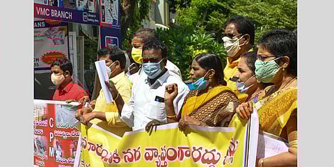 Earlier in the day, TDP, CPM corporators protested against setting up of water meters, true-up charges at VMC office on Thursday | Prasant Madugula