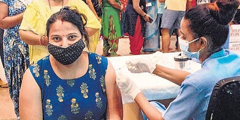 A health worker administers COVID vaccine at District hospital. (File Photo | PTI)