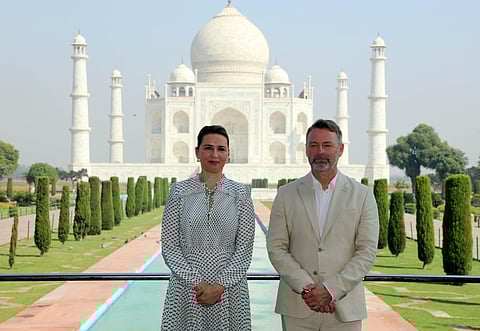 Denmark Prime Minister Mette Frederikse with her husband pose for a photo as they visit the Taj Mahal, in Agra on Sunday. (Photo | PTI)
