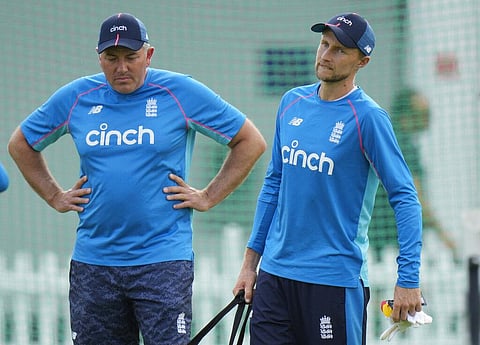 England's cricket coach Chris Silverwood, left, speaks his team captain England's Joe Root during a practice session in London. (Photo | AP)