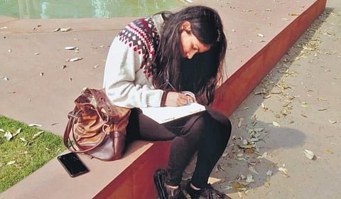 Tulika Mohanty pens down her thoughts in her journal.