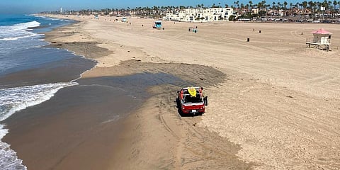 Few people visit the beach a week after the ocean was closed to surfing and swimming due to an offshore pipeline leak in Huntington Beach, California. (Photo | AP)
