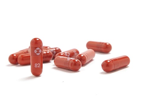 Merck & Co. shows their new antiviral medication. The drugmaker has said its experimental pill for people sick with COVID-19 reduced hospitalizations and deaths. (Photo | AP)
