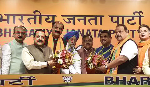 Former J&K National Conference leaders Devender Rana and Surjit Singh Slathia join BJP in presence of Union Ministers Hardeep Singh Puri, Dharmendra Pradhan, and Jitendra Singh. (Photo | Parveen Negi)