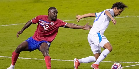 El Salvador's Enrico Duenas (R) and Costa Rica's Joel Campbell during a qualifying match for the FIFA World Cup Qatar 2022 at National stadium in San Jose. (Photo| AP)