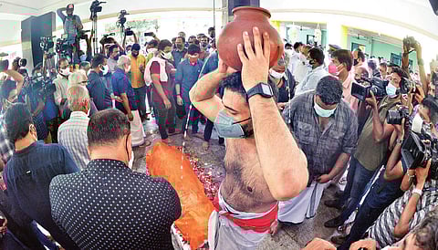 Unni Venu, elder son of Nedumudi Venu, performing the last rites for his father at Santhikavadom in Thiruvananthapuram on Tuesday. The actor was cremated with full state honours | Vincent Pulickal