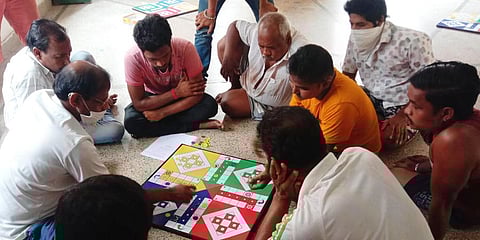 People engaged in playing a game of Ludo in Cuttack. (Photo | EPS)