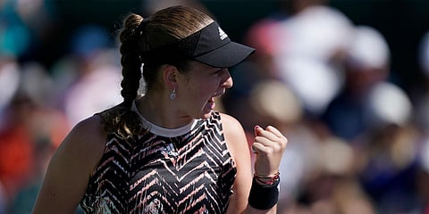 Jelena Ostapenko, of Latvia, celebrates after winning a game against Iga Swiatek, of Poland, at the BNP Paribas Open tournament. (Photo| AP)