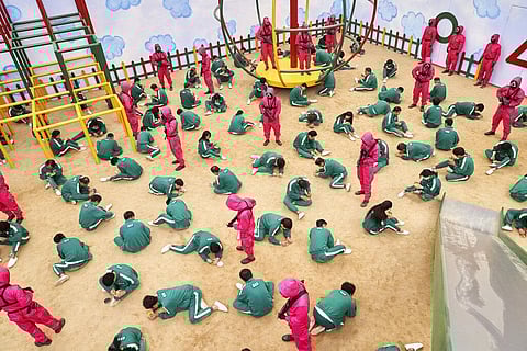 This undated photo released by Netflix shows a scene of contestants vying to win the Dalgona Korean candy challenge in a scene from 'Squid Game.' (Photo | AP)