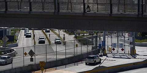 A few cars make their way north to cross into the United States from Tijuana, Mexico. (Photo | AP)