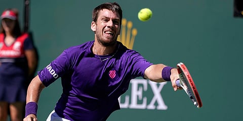 Cameron Norrie returns to Diego Schwartzman at the BNP Paribas Open tournament in Indian Wells. (Photo| AP)