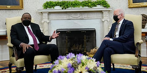 US President Joe Biden (R) listens as Kenyan President Uhuru Kenyatta (L) speaks during their meeting in the Oval Office of the White House in Washington. (Photo | AP)